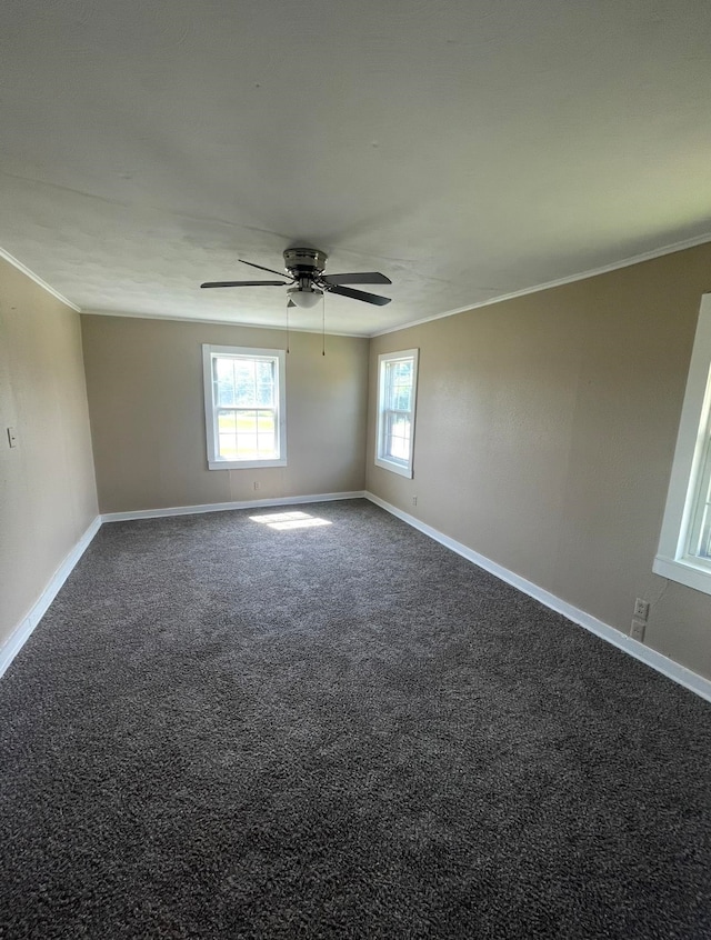 unfurnished room with ornamental molding, carpet floors, and ceiling fan