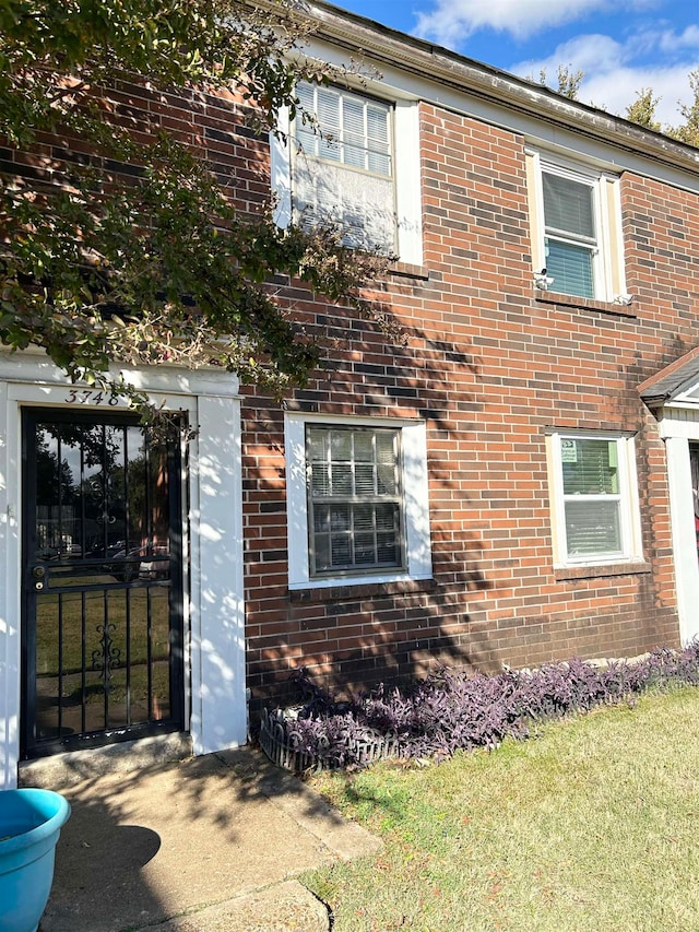 view of property exterior featuring a lawn