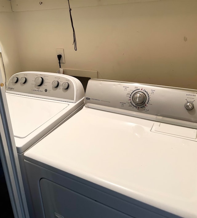 washroom with independent washer and dryer