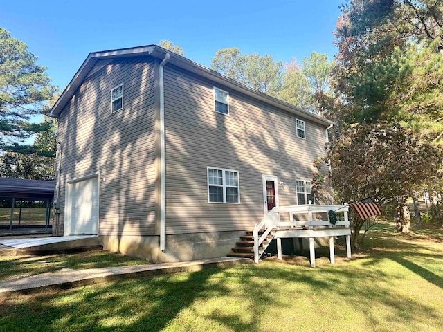 back of house with a yard and a wooden deck