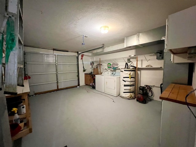 garage featuring washing machine and dryer