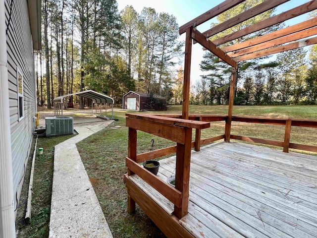 wooden terrace with a storage unit, a yard, cooling unit, and a pergola