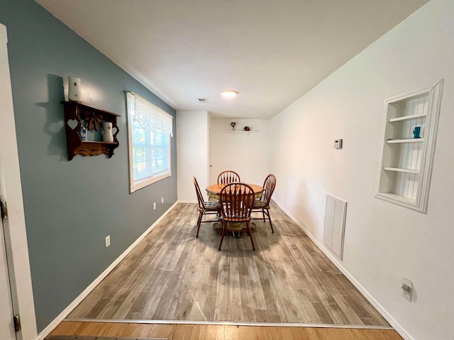 dining space featuring hardwood / wood-style floors