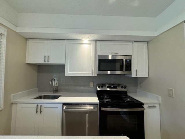 1231 Chamberlain Dr Unit 1231, Memphis, TN 38119 - kitchen with a sink, appliances with stainless steel finishes, and light countertops