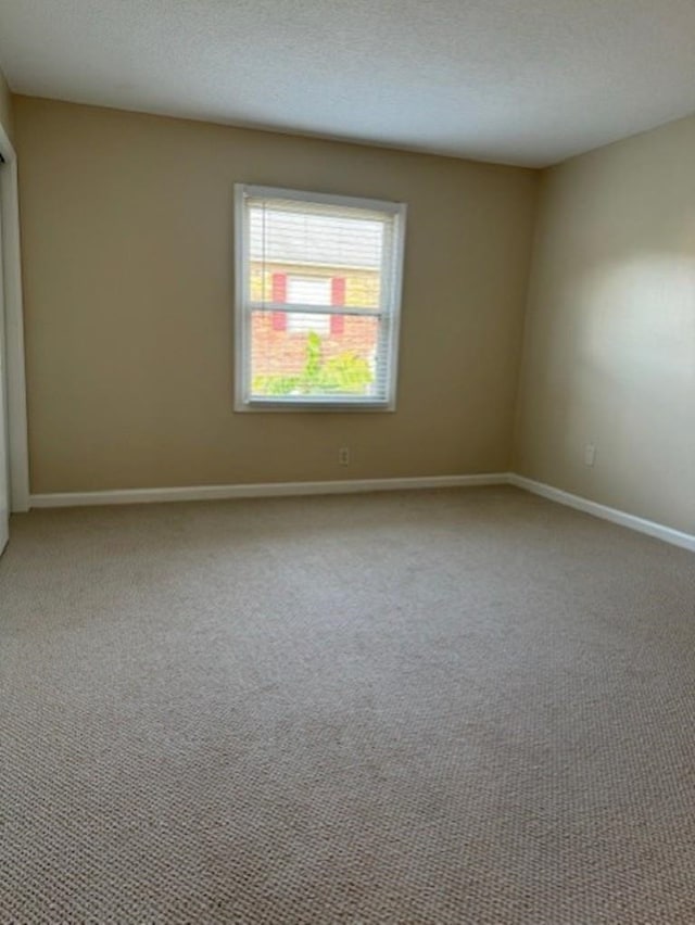 1231 Chamberlain Dr Unit 1231, Memphis, TN 38119 - carpeted spare room featuring baseboards and a textured ceiling