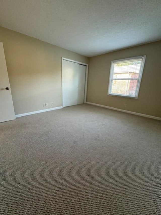 1231 Chamberlain Dr Unit 1231, Memphis, TN 38119 - carpeted empty room featuring baseboards and a textured ceiling
