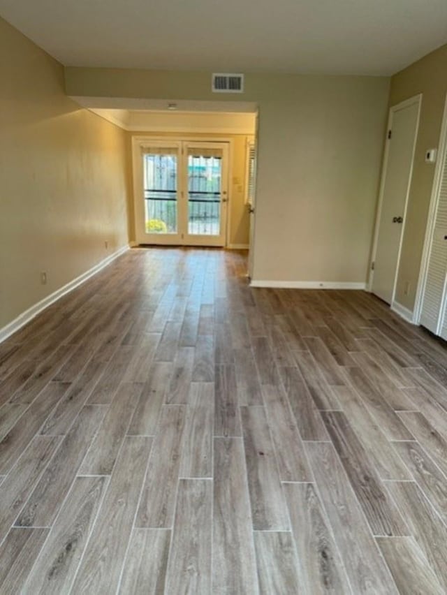 1231 Chamberlain Dr Unit 1231, Memphis, TN 38119 - unfurnished room with visible vents, baseboards, and wood finished floors