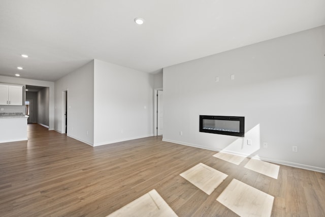 unfurnished living room featuring light hardwood / wood-style flooring