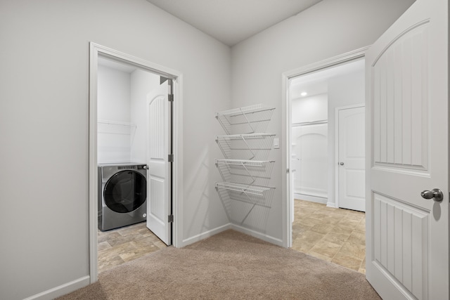 laundry room featuring washer / dryer and light colored carpet