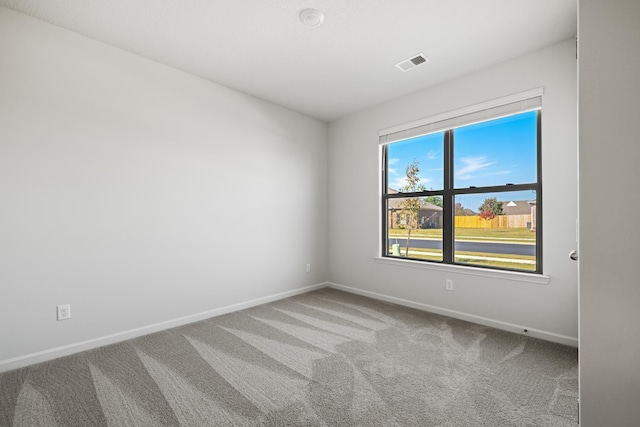 empty room featuring carpet flooring