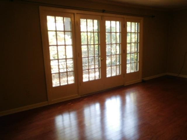 doorway with wood-type flooring