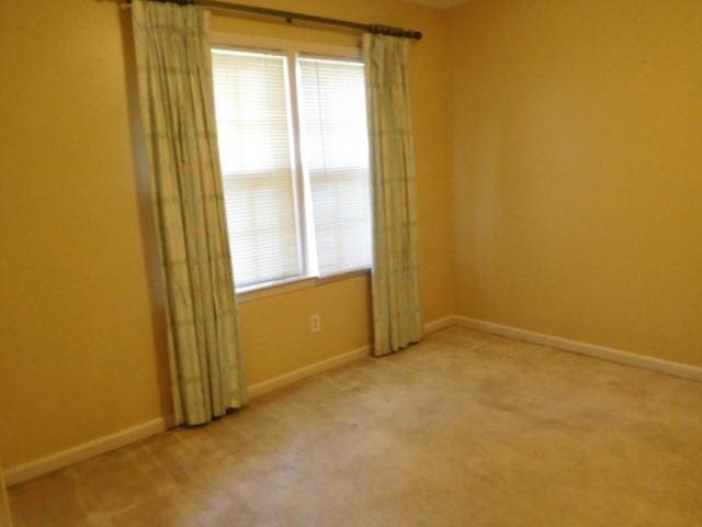 unfurnished room with carpet flooring