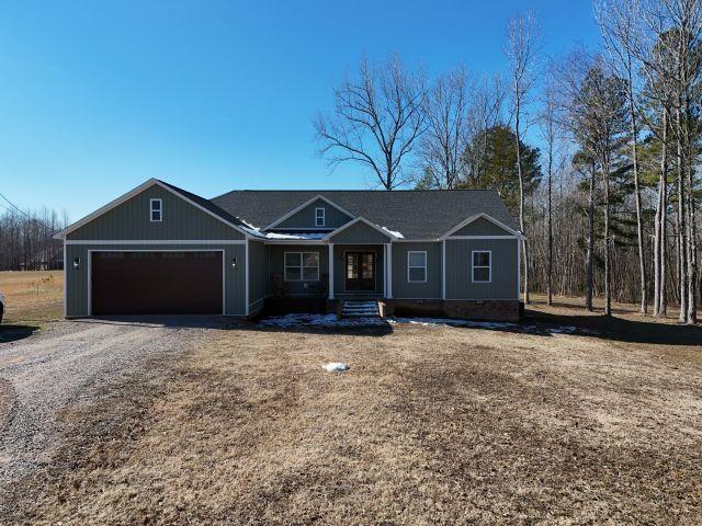 single story home featuring a garage