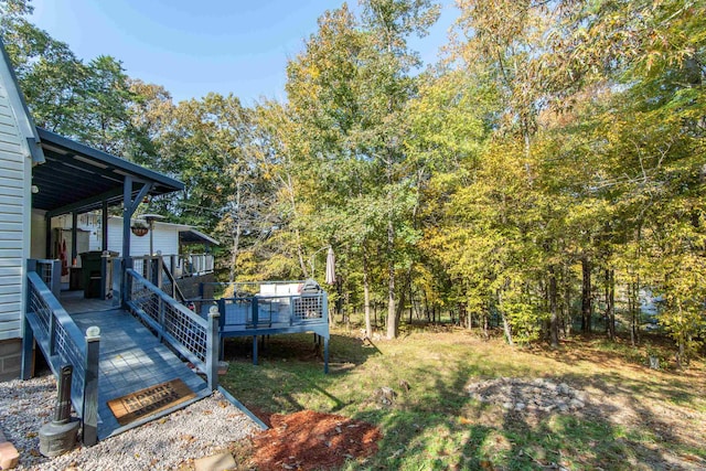 view of yard featuring a wooden deck