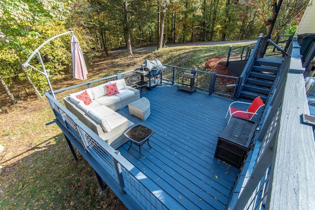 deck featuring an outdoor living space and a grill