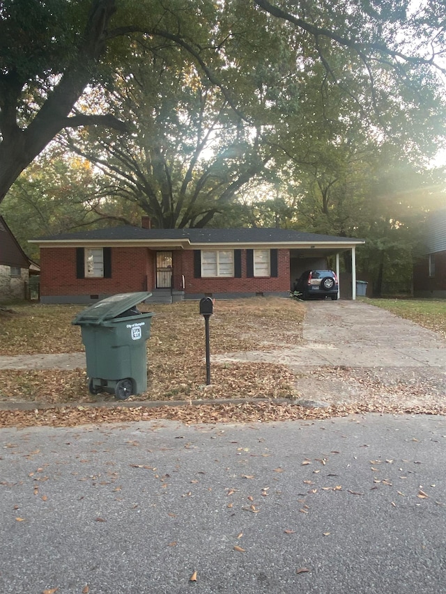 single story home featuring a carport