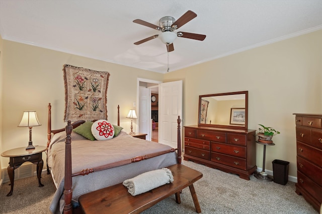 bedroom with ornamental molding, light colored carpet, and ceiling fan