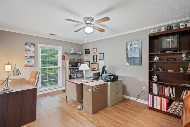 office space featuring ornamental molding, a textured ceiling, light wood-type flooring, and ceiling fan