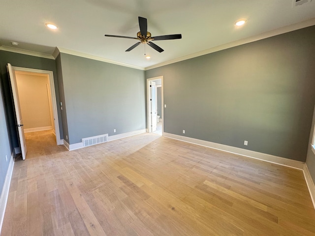 empty room featuring ceiling fan, light hardwood / wood-style floors, and ornamental molding