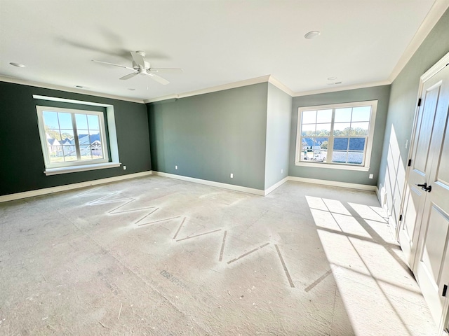 spare room featuring ceiling fan and ornamental molding