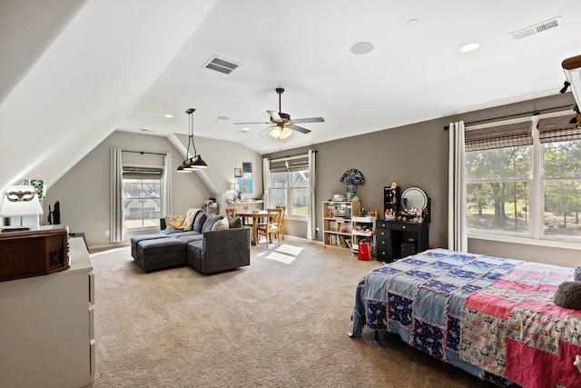 carpeted bedroom featuring ceiling fan, vaulted ceiling, and multiple windows