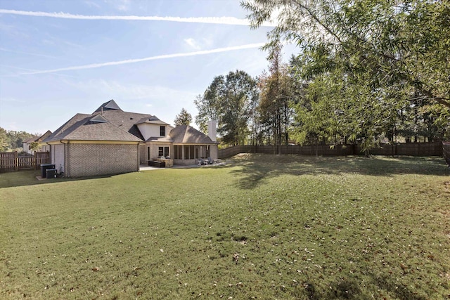 view of yard with a patio and central AC