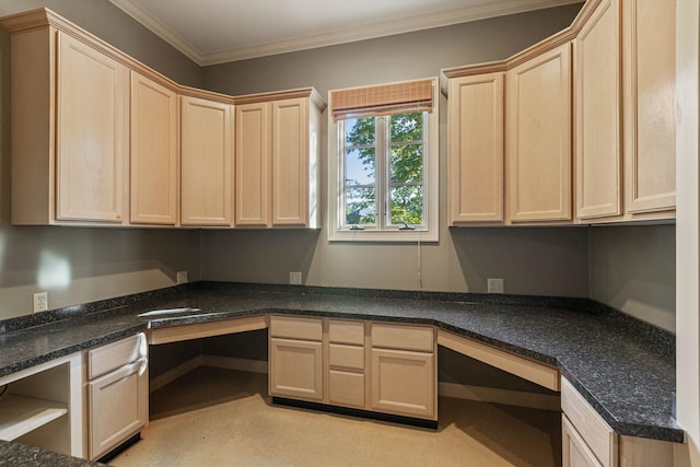 interior space featuring built in desk and ornamental molding