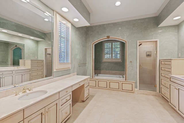 bathroom with a wealth of natural light, vanity, shower with separate bathtub, and ornamental molding