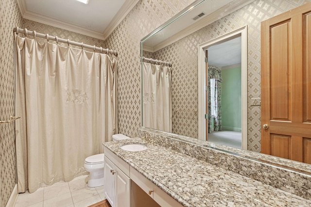 bathroom featuring vanity, crown molding, toilet, and tile patterned floors