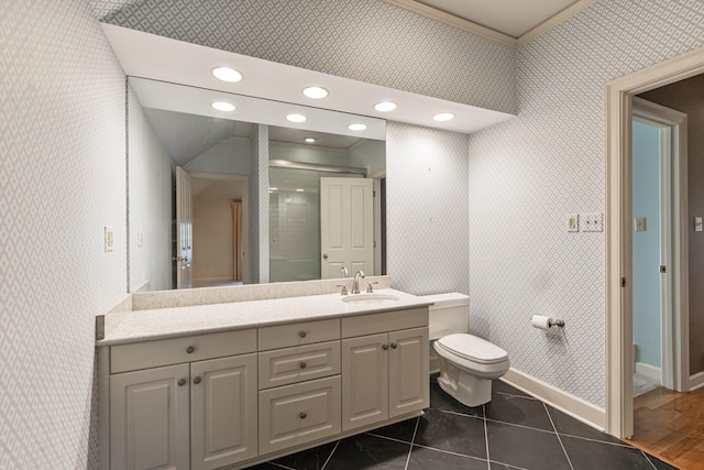 bathroom featuring lofted ceiling, hardwood / wood-style floors, toilet, ornamental molding, and vanity