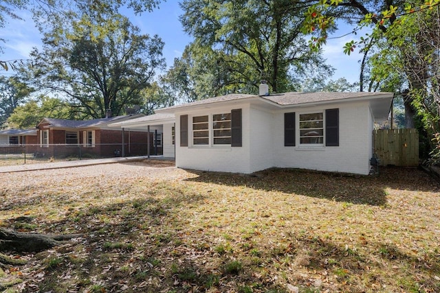 back of house with a yard