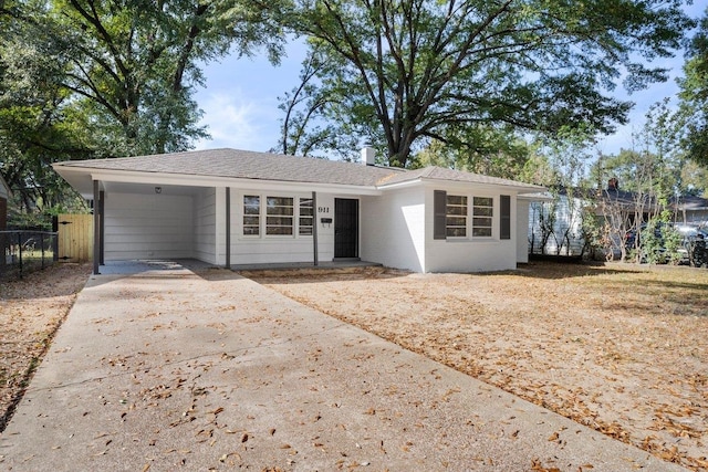 ranch-style home with a carport