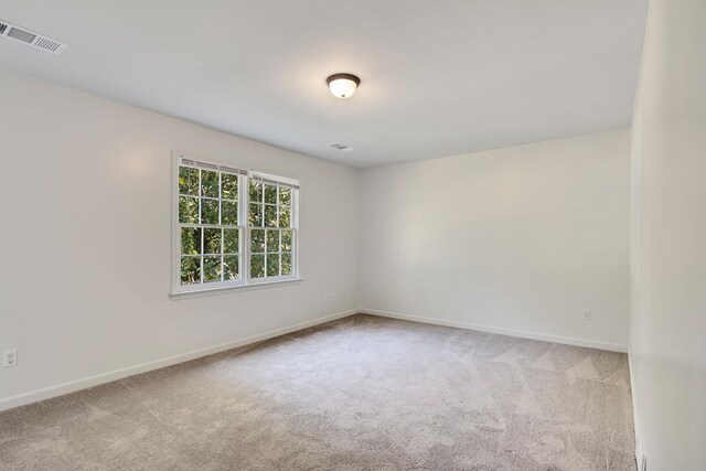 unfurnished room with carpet flooring