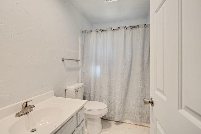 bathroom with tile patterned flooring, vanity, toilet, and a shower with shower curtain