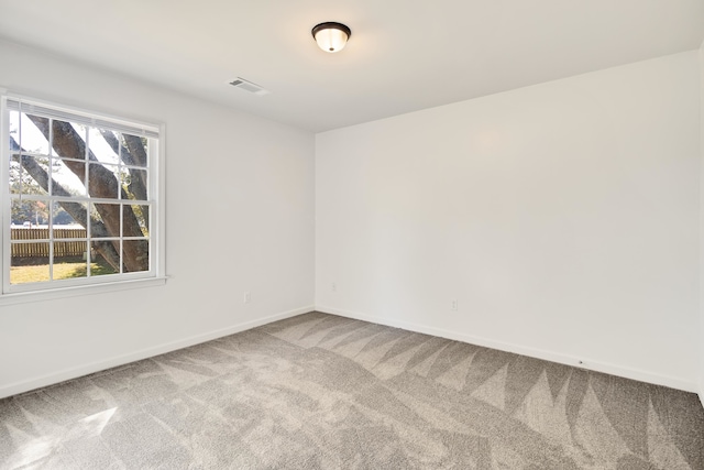 unfurnished room featuring carpet flooring