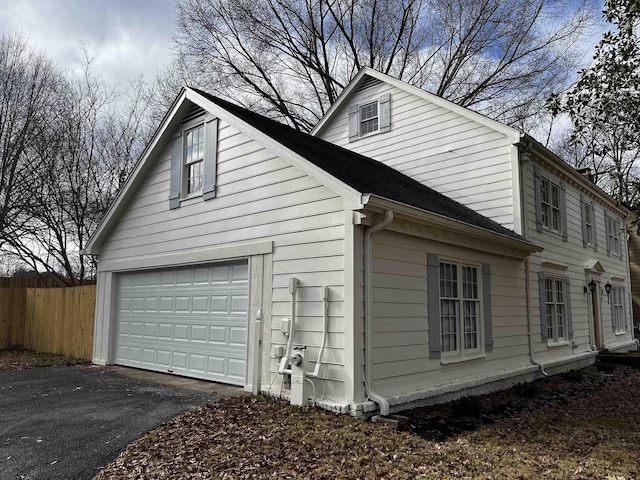 view of side of property with a garage