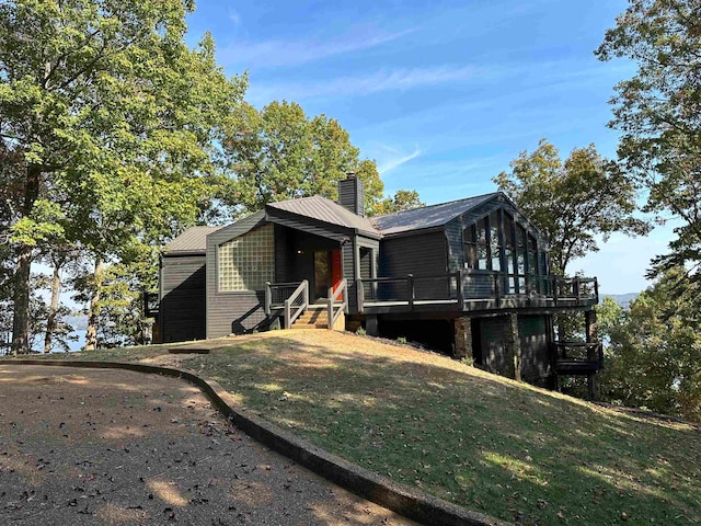 exterior space featuring a deck and a yard