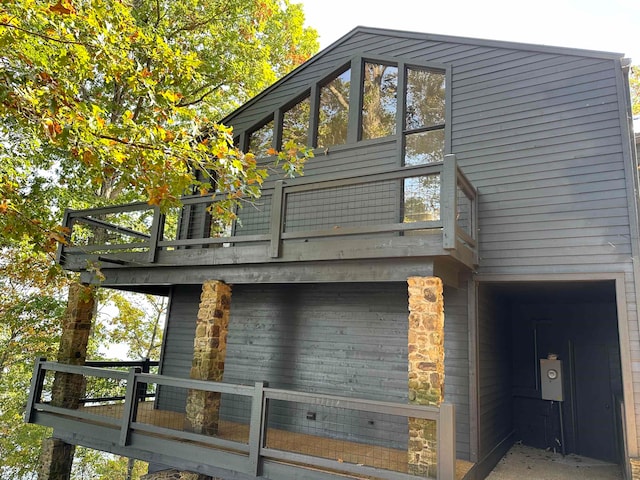 view of home's exterior with a wooden deck