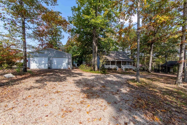 single story home with an outbuilding and a garage