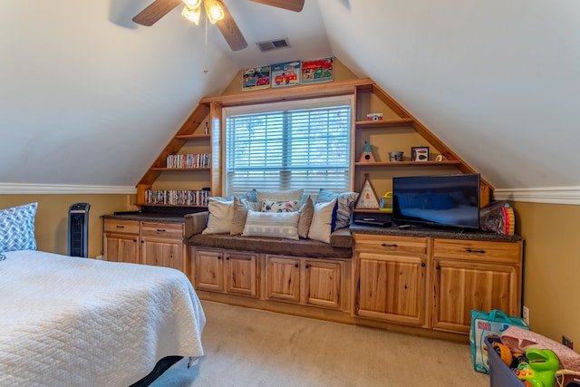 carpeted bedroom with ceiling fan and vaulted ceiling