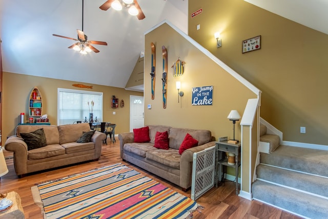 living room featuring ceiling fan, high vaulted ceiling, and hardwood / wood-style floors