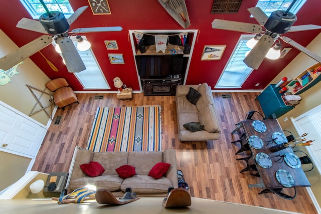 living room featuring hardwood / wood-style flooring and ceiling fan