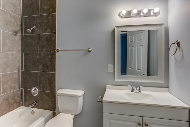 bathroom with vanity, shower / bathtub combination, and toilet
