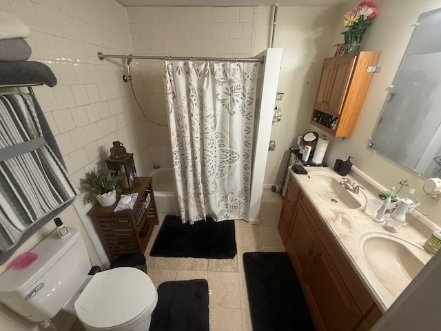 full bathroom with vanity, toilet, tile patterned floors, and shower / bath combo