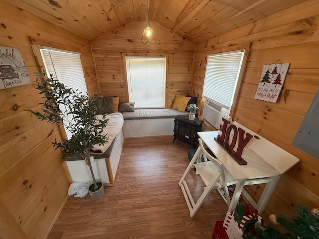 interior space featuring wood ceiling, wood walls, hardwood / wood-style flooring, and vaulted ceiling