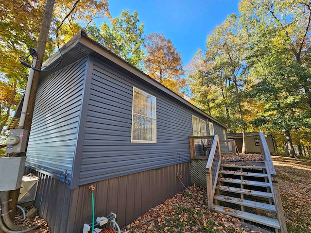 view of side of property featuring a deck