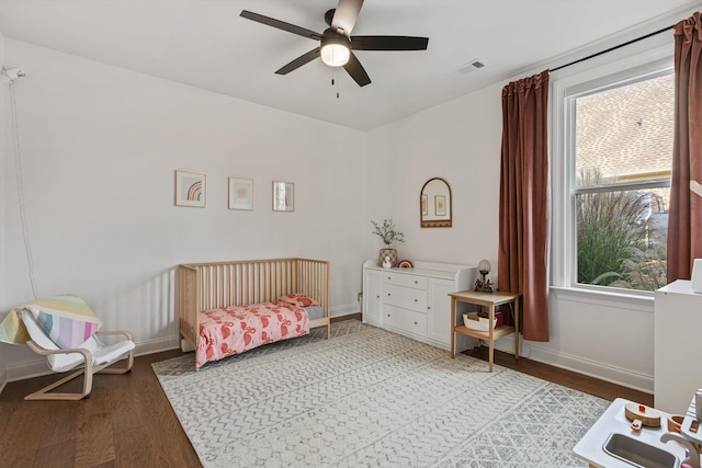 bedroom with hardwood / wood-style floors and ceiling fan