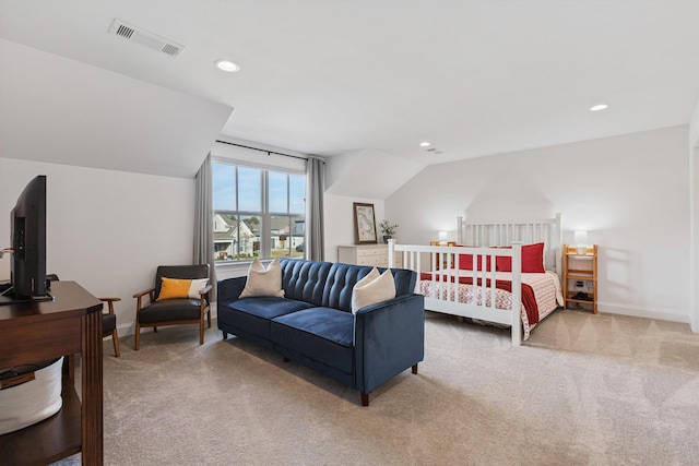 bedroom featuring vaulted ceiling and carpet floors