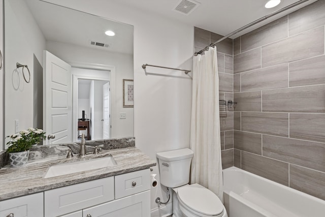 full bathroom featuring vanity, toilet, and shower / bathtub combination with curtain