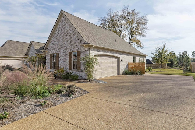 view of side of property with a garage